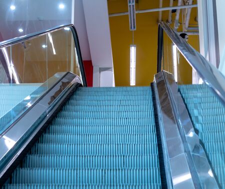 A view near the top of the escalator and neon lights found everywhere in Thai department stores.