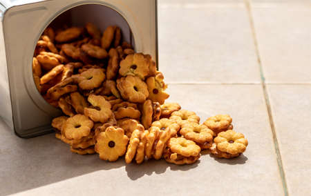Close-up: Biscuits stuffed with many pineapple jams, which are junk food, are stacked on concrete...