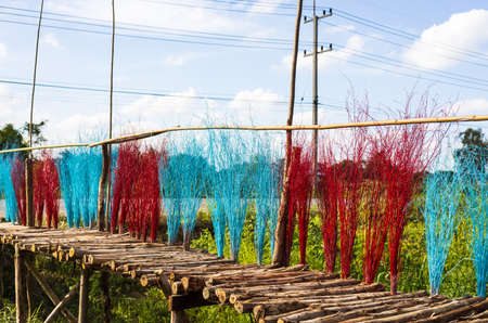 A close-up view of the many eucalyptus bridges adorned with brightly colored twigs that lead to...