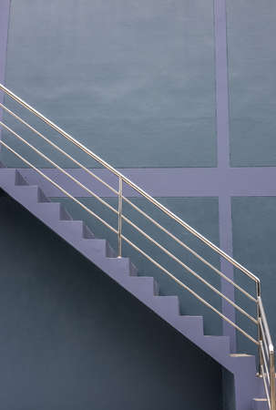 Close-up view of the background of the stairway sideways, the purple-gray wall of the building with...