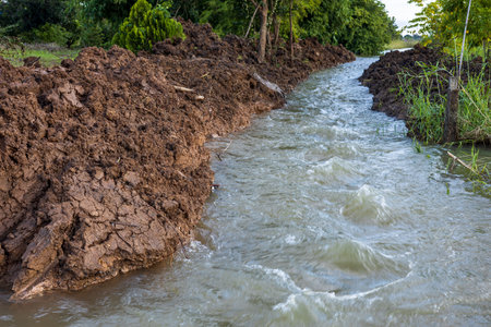 The view of the water rushing through the mounds of soil that have been dug up to form a coastal...