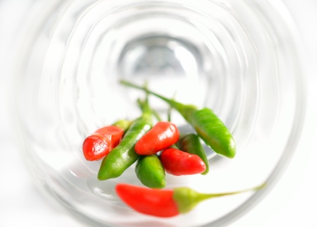 Chili in glasses, isolated on white