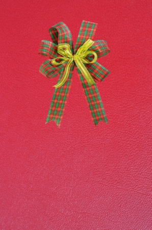 Gift bow on red backgroundの写真素材