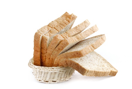whole wheat bread in basket against a white backgroundの写真素材