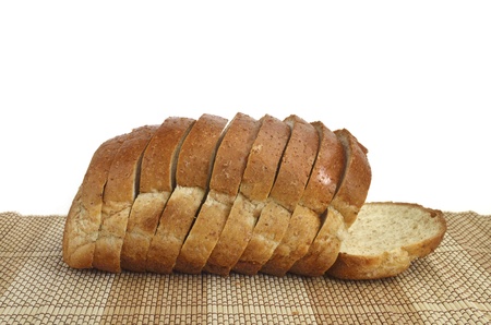 sliced whole wheat bread on wood background