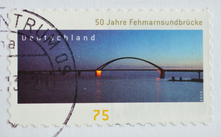 GERMANY - CIRCA 2013 A stamps printed in Germany shows commemorates 50 years of the Fehmarn Sound Bridge, which connects the island of Fehmarn with mainland Germany, circa 2013のeditorial素材