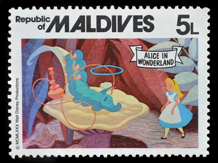 REPUBLIC OF MALDIVES - CIRCA 1980 : postage stamp printed in Maldives shows Alice in wonderland, circa 1980.のeditorial素材