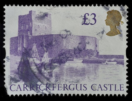 UNITED KINGDOM - CIRCA 1992 : postage stamp printed in United Kingdom shows Carrickfergus Castle, circa 1992のeditorial素材