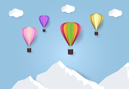 Paper art of hot air balloon travel in blue sky over mountain. Paper cut style illustration.のイラスト素材