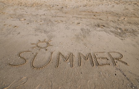 Summer inscription on the sand backgroundの写真素材
