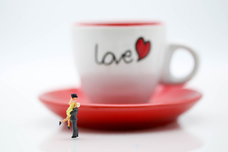 Miniature people : Couple Lover standing with cup off coffee, lovely concept.の写真素材