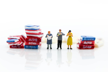 Miniature people :  reading books using as background education or business conceptの写真素材