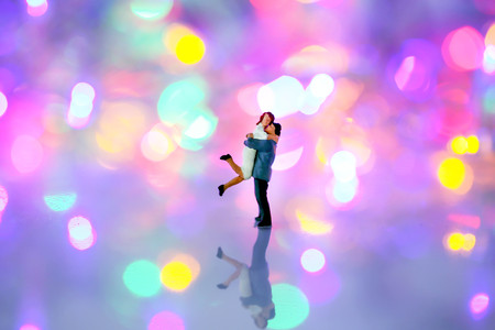 Miniature people : couple  in love and hugging over with bokeh background,love concept.の写真素材