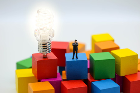 Colourful wood blocks stack game with lamp idea , playing and learning background concept.の写真素材