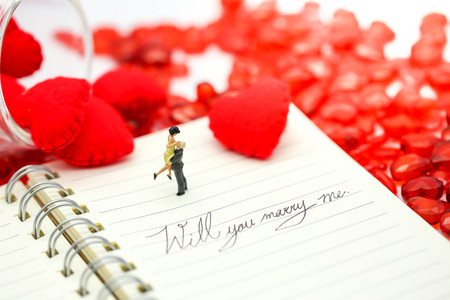 Miniature people: Couple and valentine decorations character with copy space using as background valentine day, Love couple conceptの写真素材