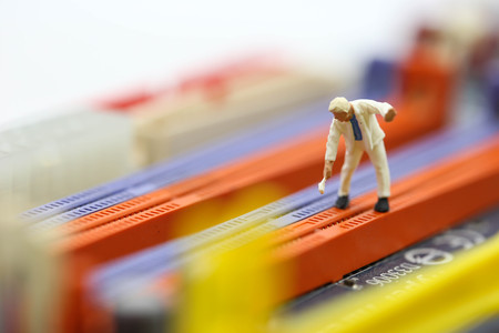 Miniature people : engineer and worker working on computer mainboard bitcoin concept.の写真素材