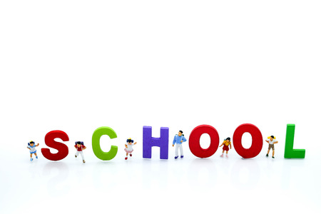 Miniature people : children and student with colorful wooden English alphabe,education concept.