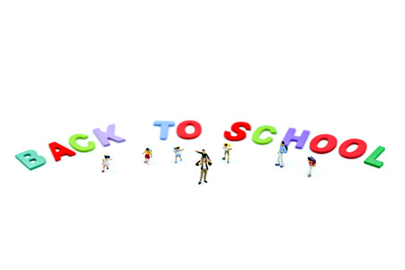 Miniature people : children and student with colorful wooden English alphabe,education concept.