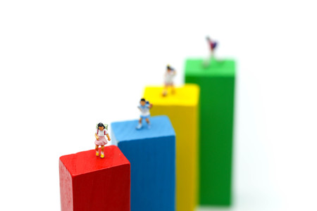 Miniature people : children and student  with colour wooden block,play and education concept.の写真素材