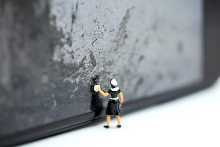 Miniature people : Maid cleaning a wall dirty.の写真素材