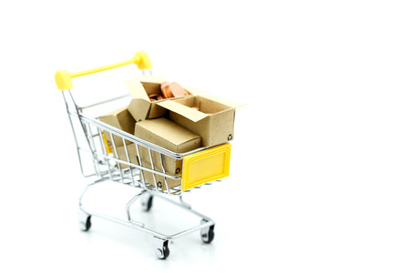 Shopping cart with small house,shopping, rent, loan, mortgage, eco district housing concept.の写真素材