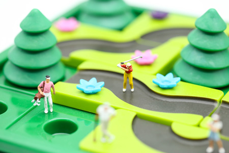 Miniature people : golfer stand with children's toys collection,sport and education concept.の写真素材