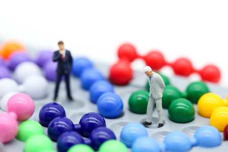 Miniature people : Businessman with Colorful abacus and kids toy,business and education concept.の写真素材