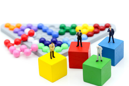 Miniature people : Businessman with Colorful abacus and kids toy,business and education concept.の写真素材