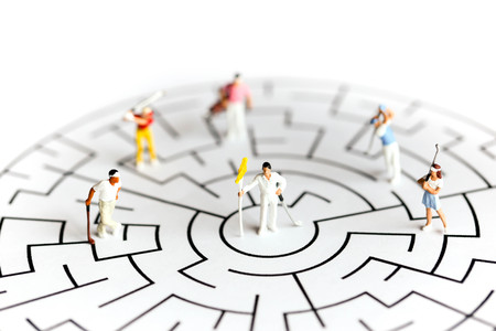 Miniature people : golfer stand on maze ,business or sport concept.の写真素材