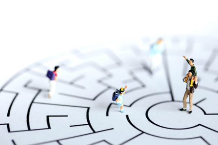 Miniature people : children stand on maze ,fun and Education concept.の写真素材