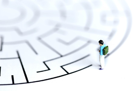 Miniature people : children stand on maze ,fun and Education concept.の写真素材