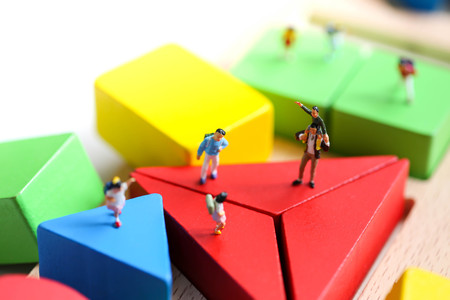 Miniature people : children with wooden block toy, Education concept.の写真素材