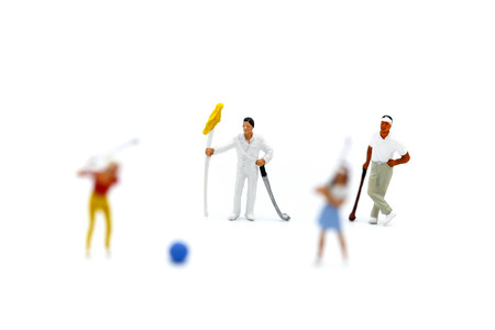 Miniature people : Golfer teams playing.の写真素材