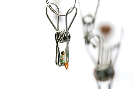 Miniature people : Joyful swinging on a swing,Fun and happiness concept.の写真素材