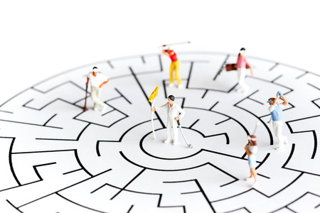 Miniature people : golfer stand on maze ,business or sport concept.の写真素材