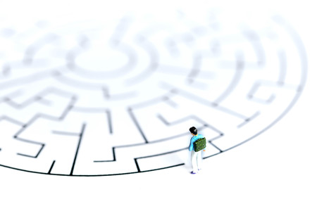 Miniature people : children stand on maze ,fun and Education concept.