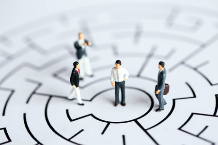 Miniature people : Businessman  stand on maze ,business concept.の写真素材