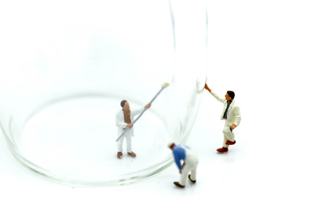 Miniature people : worker clean a glass.の写真素材