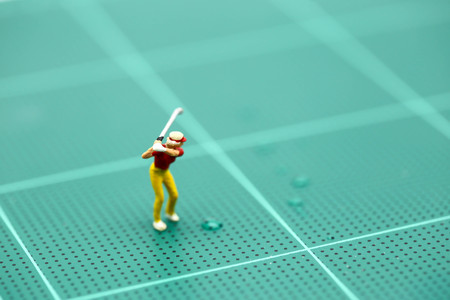 Miniature people : Golfer teams playing.の写真素材