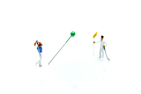 Miniature people : Golfer teams playing.の写真素材