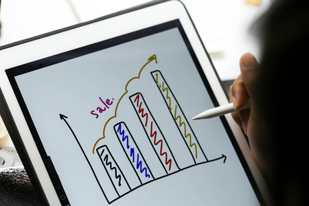 Businessman writing touch pad on wording Business.の写真素材