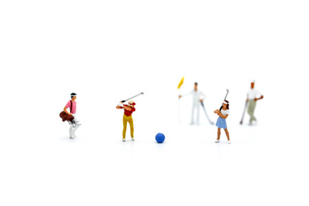 Miniature people : Golfer teams playing.の写真素材