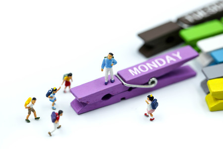 Miniature people : children and teacher with wooden color of list everyday.の写真素材