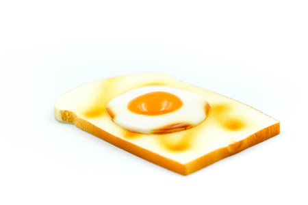 Toast bread with egg on white background.の写真素材