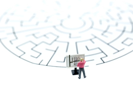 Miniature people :  teacher standing on  maze.の写真素材