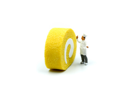 Miniature people : Chef with  sweet desserts.の写真素材