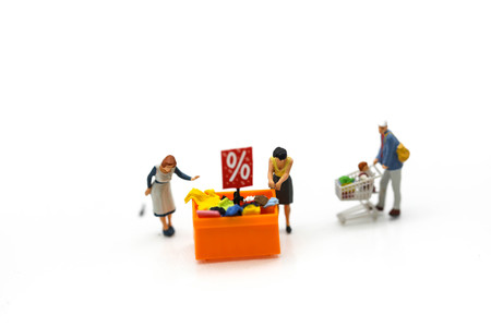 Miniature people : Shoppers with discount for shopping items,shopping business concept.の写真素材