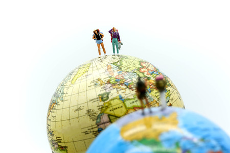 Miniature people : traveler  with world map, backpack and travel concept.の写真素材