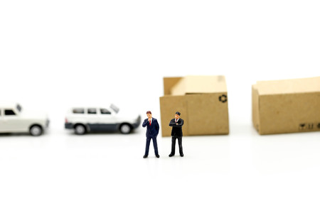 Miniature people : Businessman stand with Industrial and construction.の写真素材