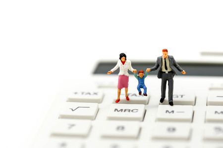 Miniature people : family holding hand with caculator.の写真素材